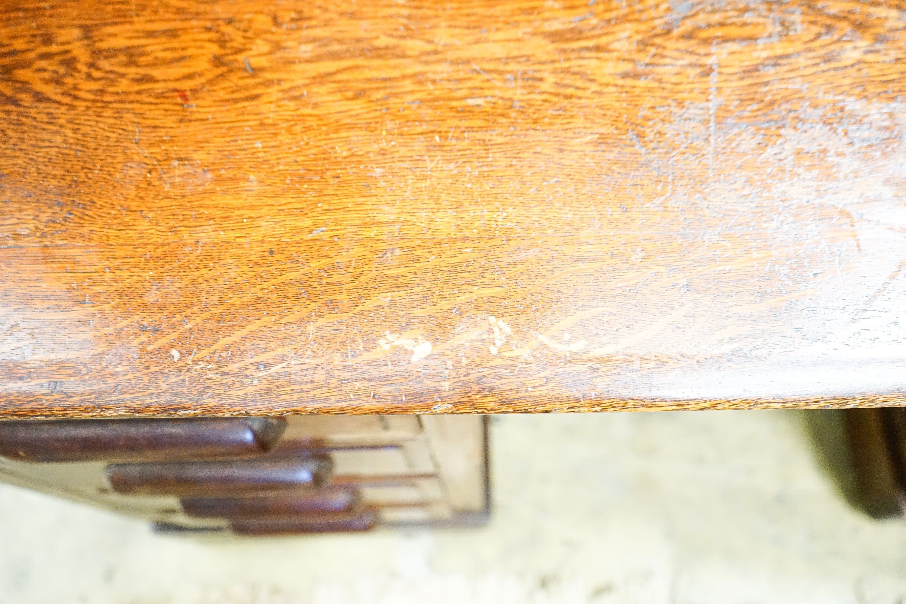 An early 20th century oak roll top desk with 'S' shape tambour, width 140cm, depth 80cm, height 128cm